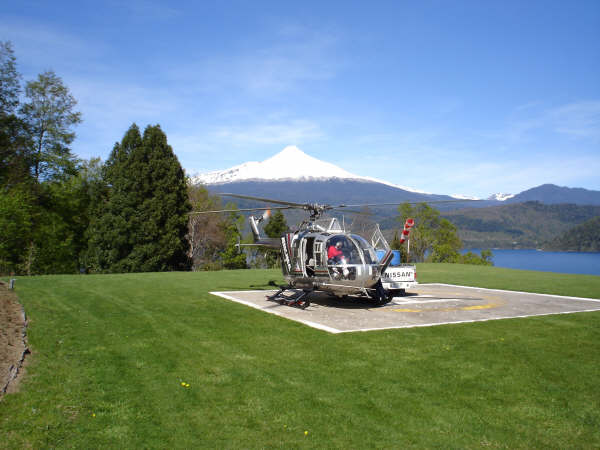 Chile Turistico helicopter with a volcano at the background.